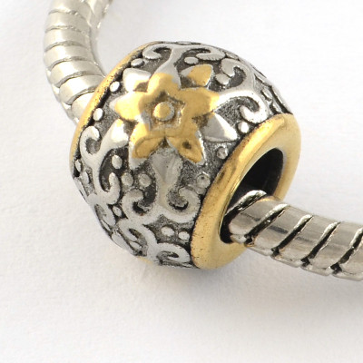 Bead with ornament in two color variants of surgical steel