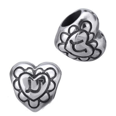 Heart-shaped bead with surgical steel ornaments