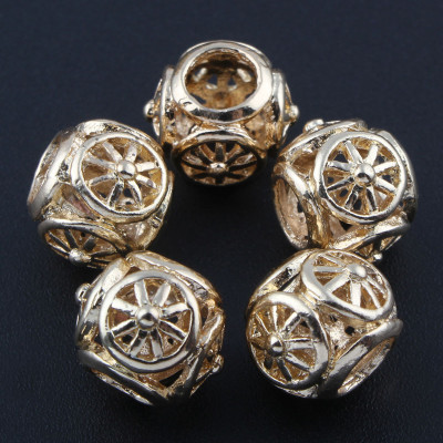 Bead with a large die-cut cut ornament from surgical steel