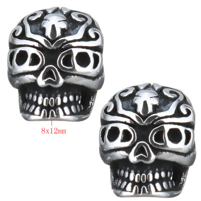 Skull with surgical steel ornament