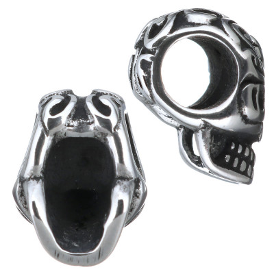 Skull with surgical steel ornament