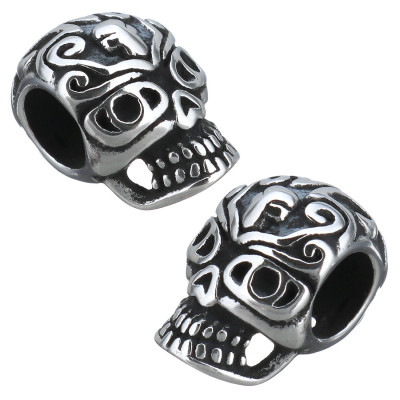Skull with surgical steel ornament