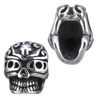 Skull with surgical steel ornament