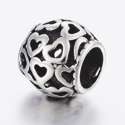 Larger pruned bead with surgical steel hearts