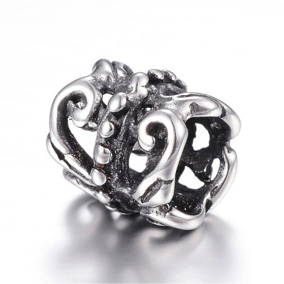 Small bead roller pruned with surgical steel ornament