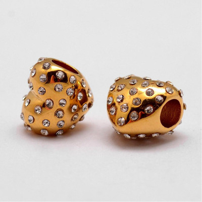 Heart bead with rhinestones in two color variants of surgical steel