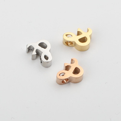 Ampersand Bead in three color combinations of surgical steel