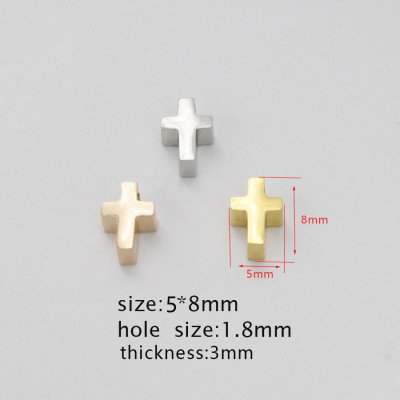 Small cross in three color variants made of surgical steel