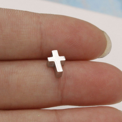 Small cross in three color variants made of surgical steel