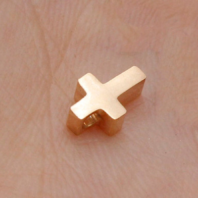 Small cross in three color variants made of surgical steel