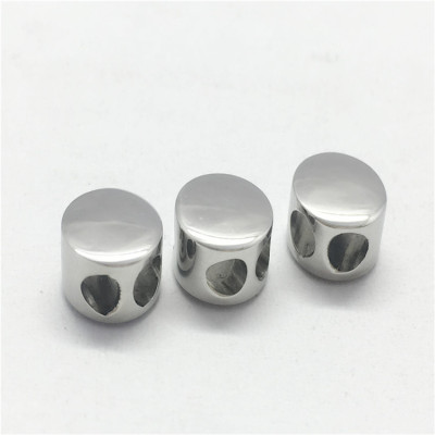 Bead polished with two holes made of surgical steel