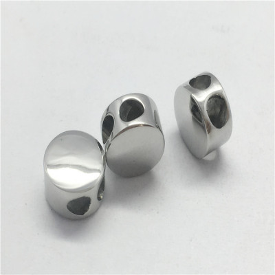 Bead polished with two holes made of surgical steel