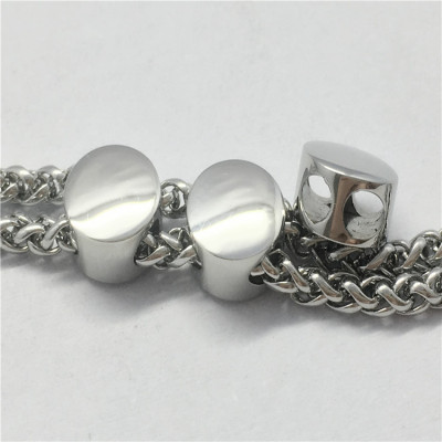 Bead polished with two holes made of surgical steel