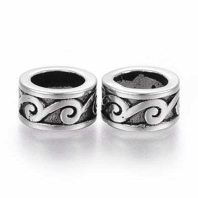 Bead with surgical steel ornament