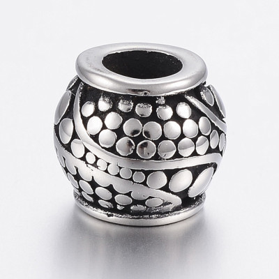Barrel bead with surgical steel ornaments