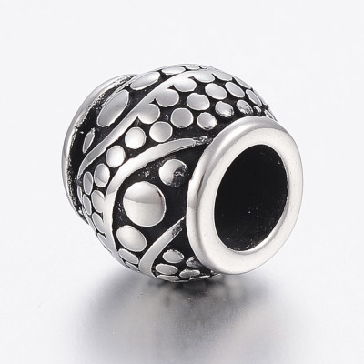 Barrel bead with surgical steel ornaments