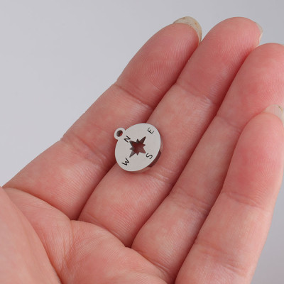 Surgical steel compass pendant in two color variants