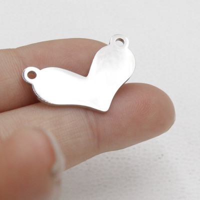 Heart connector in two color variants of surgical steel