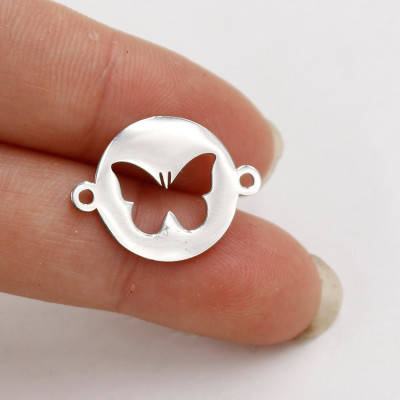 Bow tie connector in two color variants of surgical steel