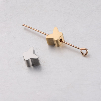 Bead with small bow tie in two colors of surgical steel