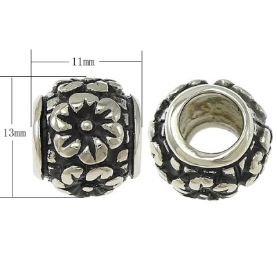 Korálek s vyraženou kytičkou uprostřed chirurgická ocel