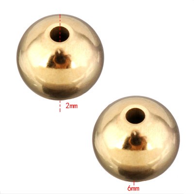 Korálek zlatá galvanizace 6mm průvlek 2mm z chirurgické oceli