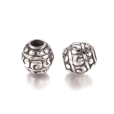 Bead with surgical steel ornament