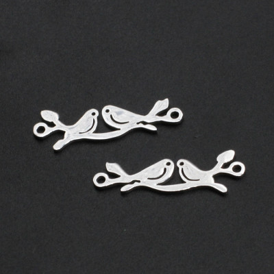 Connector birds sitting on a twig of surgical steel