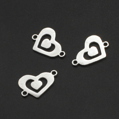 Heart connector with a small heart in the middle of surgical steel