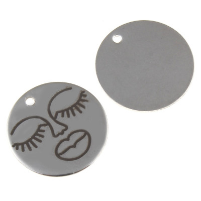 Round pendant with engraved face in the middle of surgical steel