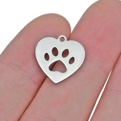 Heart-shaped pendant with a paw made of surgical steel two color combinations