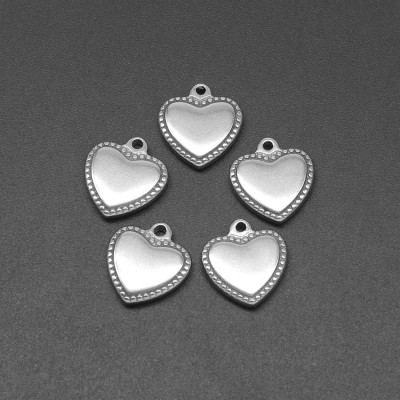 Heart pendant with decorative surgical steel edges