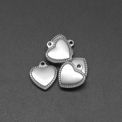 Heart pendant with decorative surgical steel edges