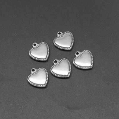 Heart pendant with decorative surgical steel edges