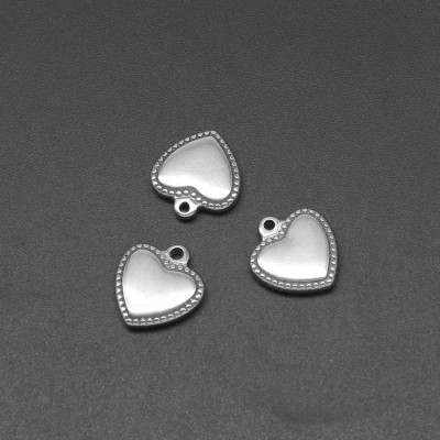 Heart pendant with decorative surgical steel edges