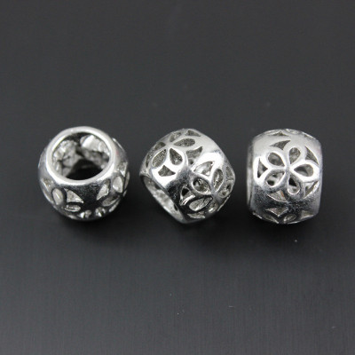 Bead with a cut flower surgical steel