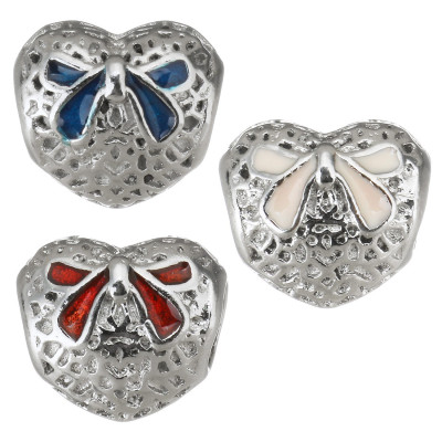 Heart with red bow from surgical steel