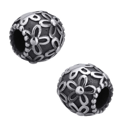 Bead with flowers on a dark background of surgical steel