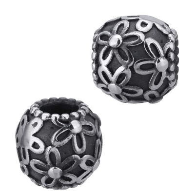 Bead with flowers on a dark background of surgical steel