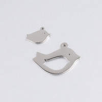 Bird pendant in two color options, surgical steel