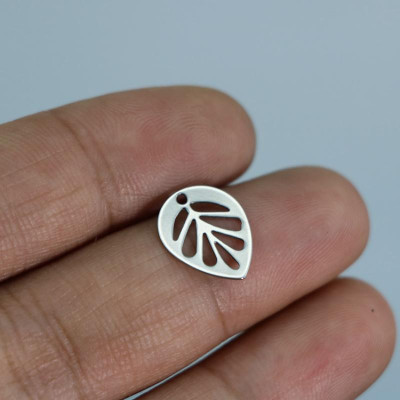 Pendant leaf cut through surgical steel