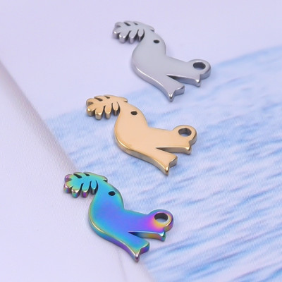 Small bird pendant with a light bulb, surgical steel