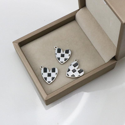 Heart pendant with black and white enamel, surgical steel