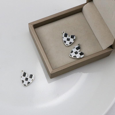 Heart pendant with black and white enamel, surgical steel