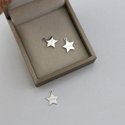 Pendant star with the inscription Luck surgical steel