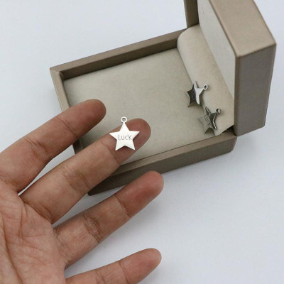 Pendant star with the inscription Luck surgical steel