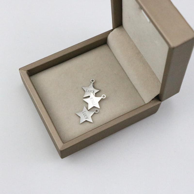 Pendant star with the inscription Luck surgical steel