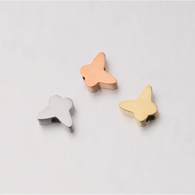 Bead with small bow tie in two colors of surgical steel