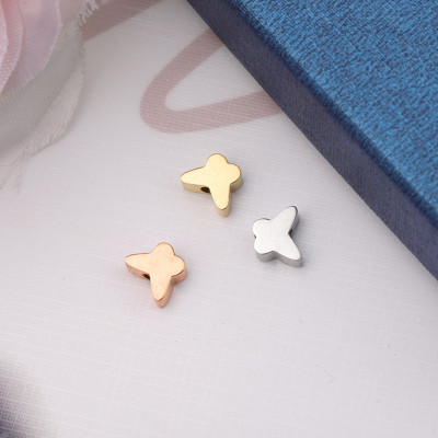 Bead with small bow tie in two colors of surgical steel