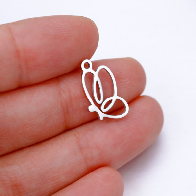 Surgical steel bow tie pendant, two color variants